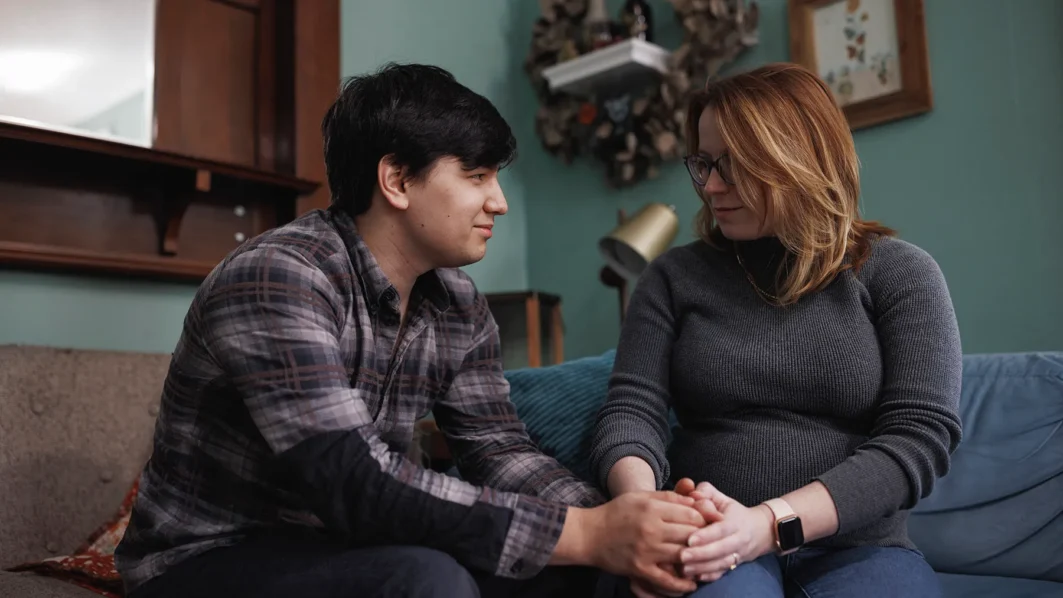 Ann Carver and her husband are photographed at home in Atlanta, Georgia in November 2023. She is pregnant again for the third time after suffering through two previous losses, one before Roe was overturned and the second after. (MELISSA GOLDEN FOR THE 19TH)