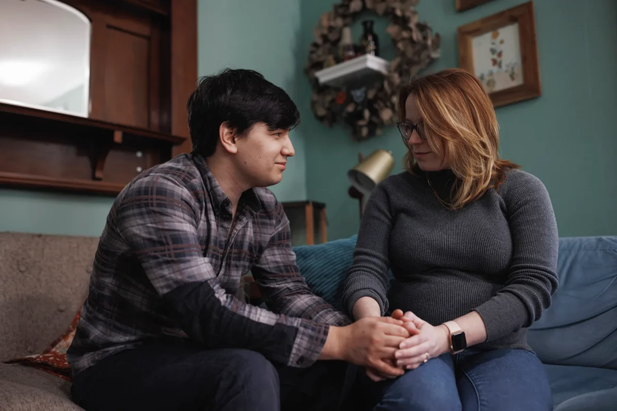 Ann Carver and her husband are photographed at home in Atlanta, Georgia in November 2023. She is pregnant again for the third time after suffering through two previous losses, one before Roe was overturned and the second after. (MELISSA GOLDEN FOR THE 19TH)