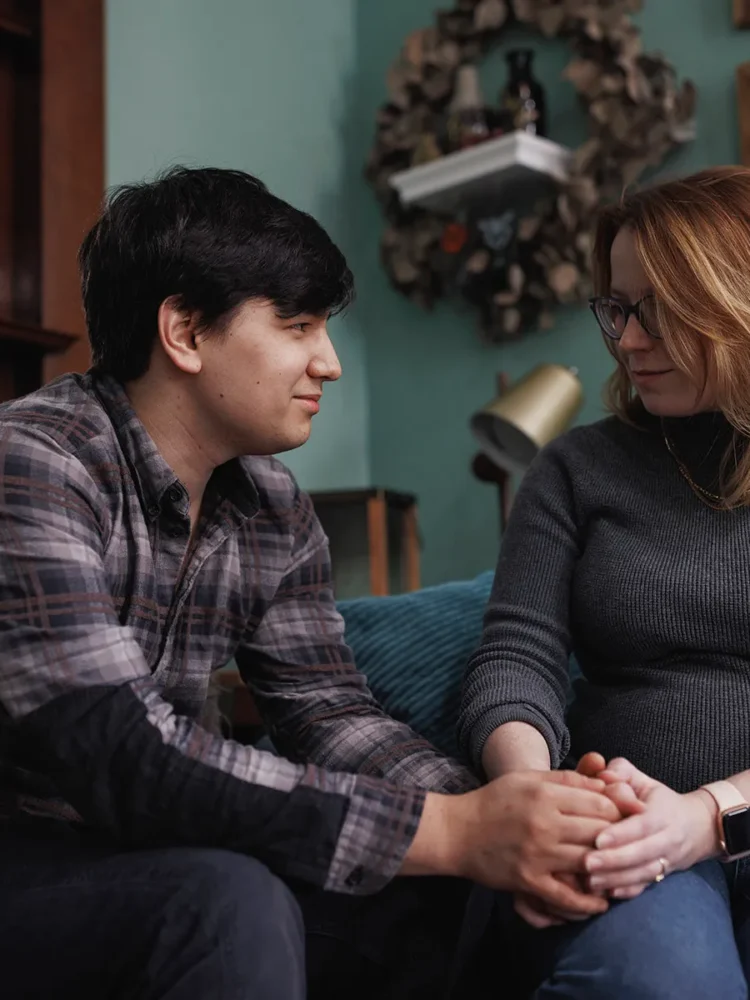 Ann Carver and her husband are photographed at home in Atlanta, Georgia in November 2023. She is pregnant again for the third time after suffering through two previous losses, one before Roe was overturned and the second after. (MELISSA GOLDEN FOR THE 19TH)