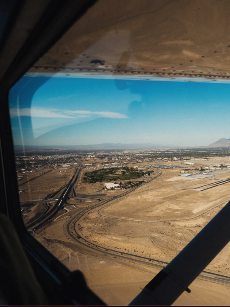 A remote area of land from the window of Clyde's plane.