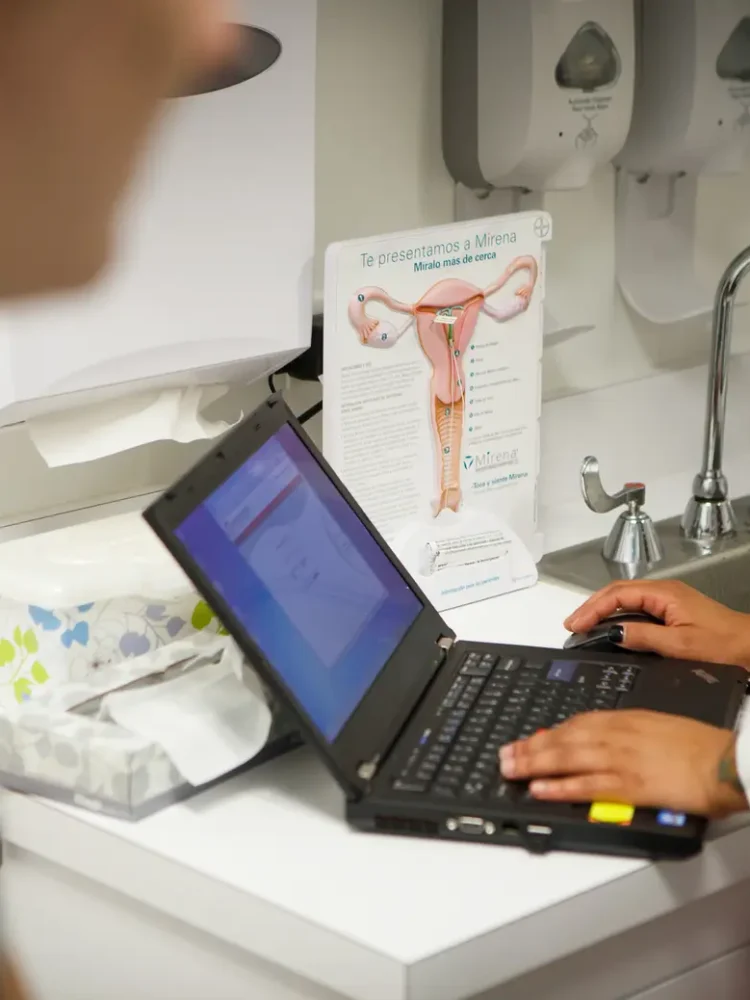 A nurse speaks with a patient at a clinic in Houston on Aug. 2, 2013. Credit: Michael Stravato for The Texas Tribune