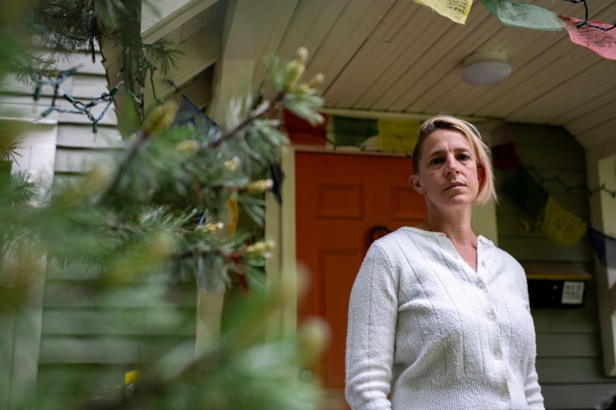Rachel Castor, a single mom of two and teacher, stands outside her home in Sandpoint, Idaho. Castor’s son could not be admitted to the local hospital during an asthma attack because Bonner General Health lost its pediatrician coverage at the same time it closed the labor and delivery unit in 2023 following the Dobbs decision. (Photo by Erick Doxey for States Newsroom)