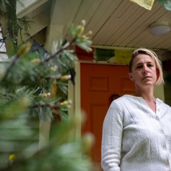 Rachel Castor, a single mom of two and teacher, stands outside her home in Sandpoint, Idaho. Castor’s son could not be admitted to the local hospital during an asthma attack because Bonner General Health lost its pediatrician coverage at the same time it closed the labor and delivery unit in 2023 following the Dobbs decision. (Photo by Erick Doxey for States Newsroom)