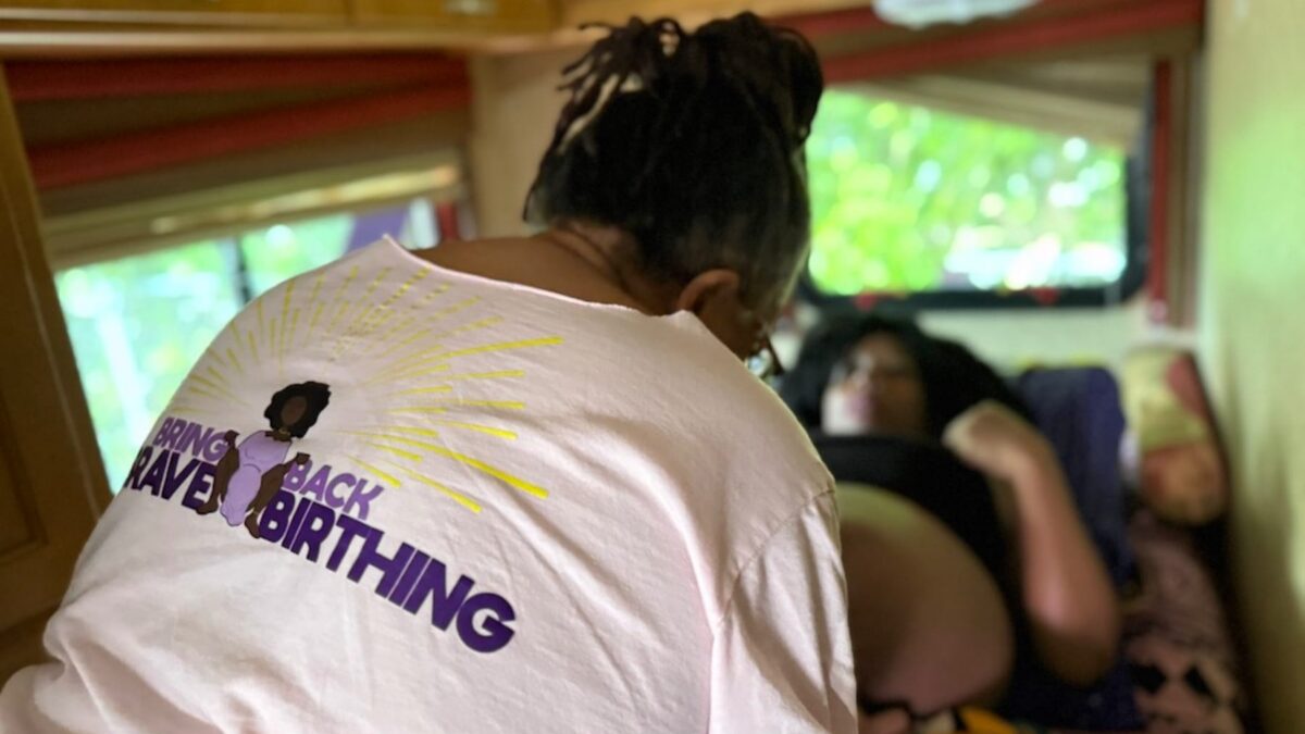 Midwife Sheila Simms Watson treats Isis Daaga during a pregnancy checkup at the Southern Birth Justice Network’s mobile midwifery clinic in Miami on March 21. (Nada Hassanein/Stateline)