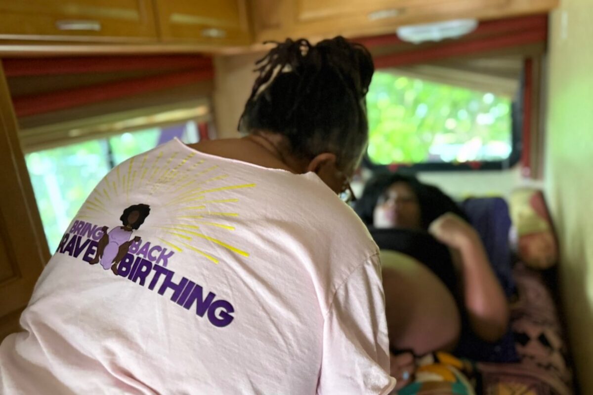Midwife Sheila Simms Watson treats Isis Daaga during a pregnancy checkup at the Southern Birth Justice Network’s mobile midwifery clinic in Miami on March 21. (Nada Hassanein/Stateline)